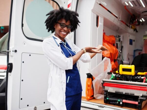 african-american-female-paramedic-standing-front-ambulance-car_151355-11135